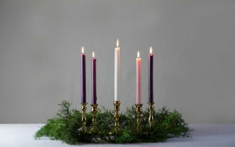 We bless our Advent Wreath and light the first candle ....