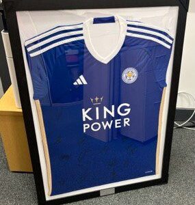 Framed and signed Leicester City First Team shirt